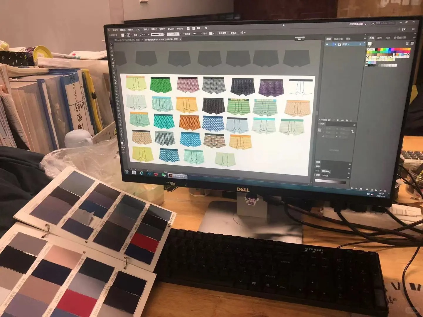 Pattern makers and international trade team reviewing CAD patterns